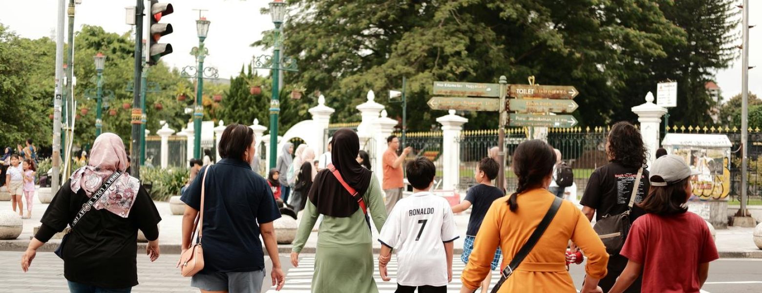 a group of people crossing the street