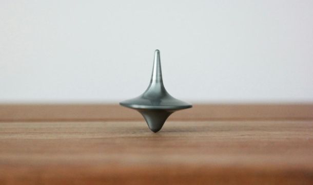 a spinning top on a wooden table