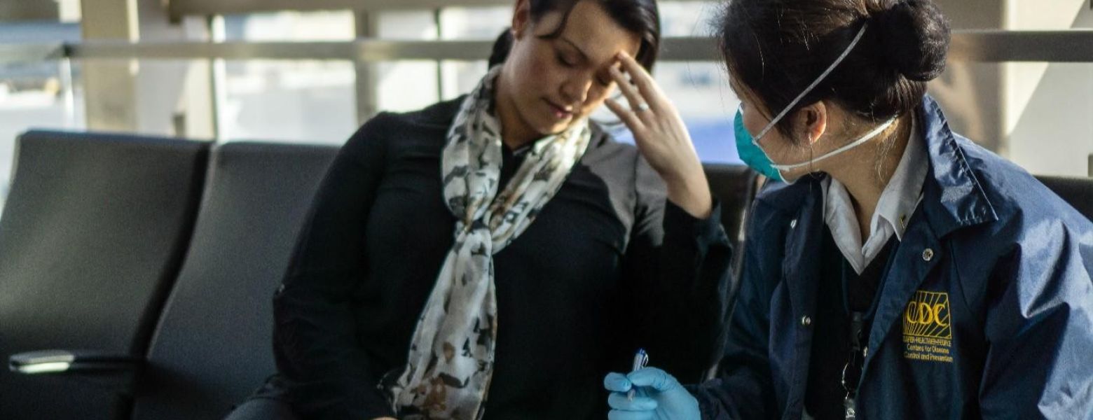 CDC interviewing a sick person inside an airport