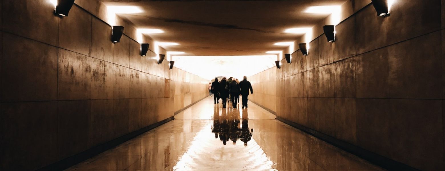 Group walking out of a tunnel