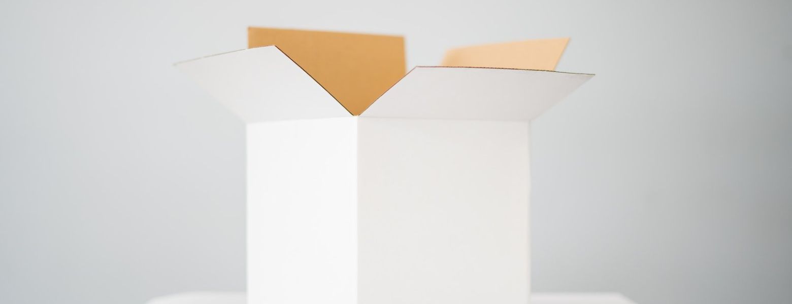 box on white table in a white room indoors