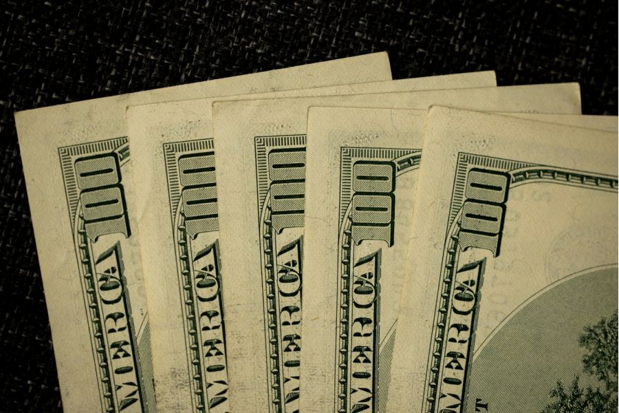 hundred dollar bills in a fan shape