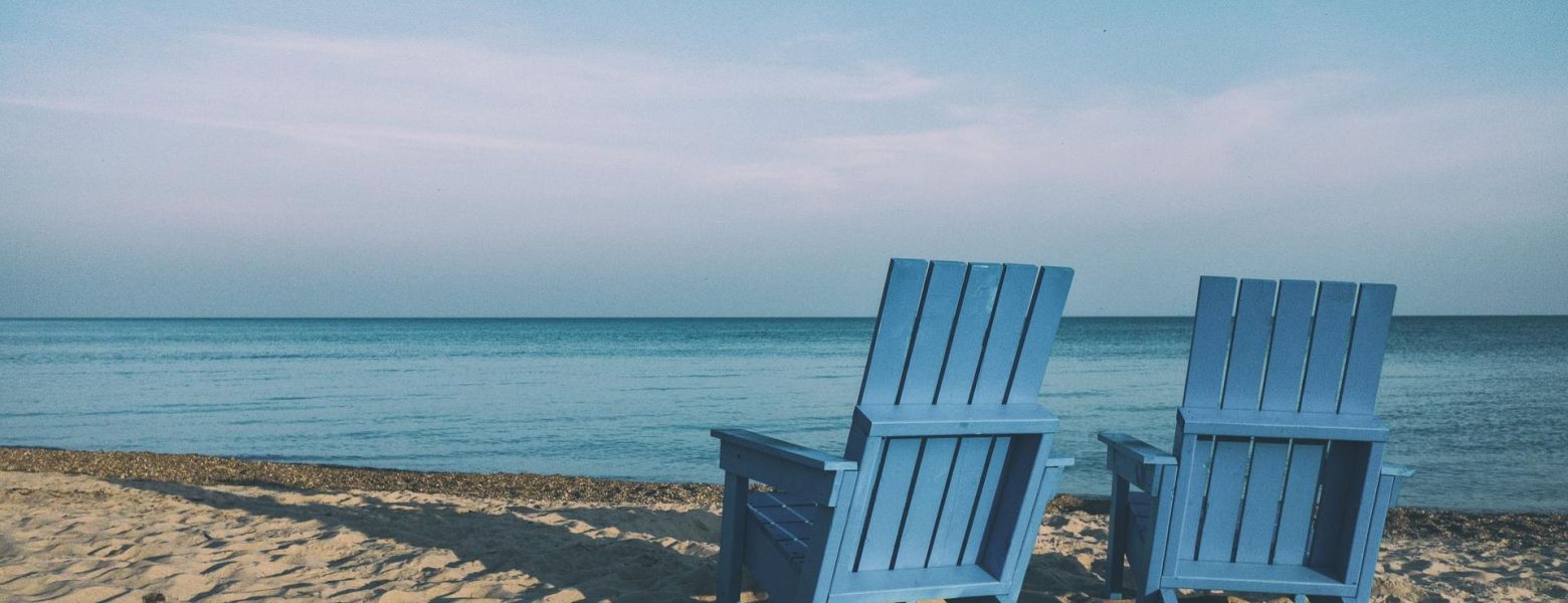 two chairs on the beach at ocean, outdoors
