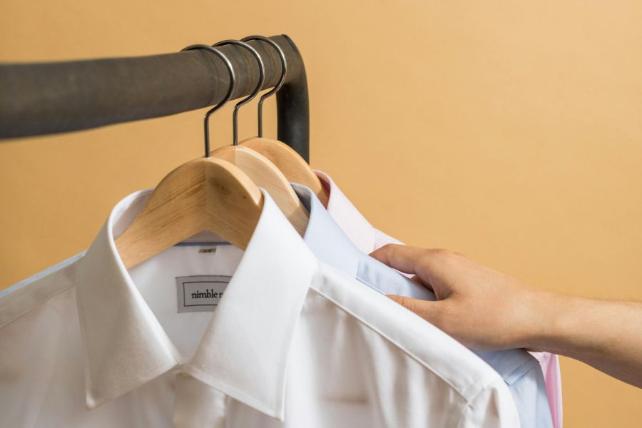 white collar shirt in a closet