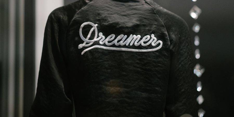person wearing a dreamer jacket