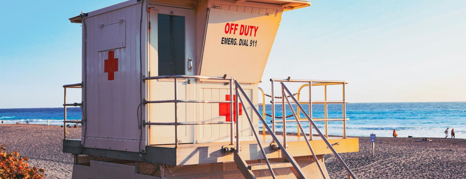 off duty life guard station, beach near ocean, blue sky