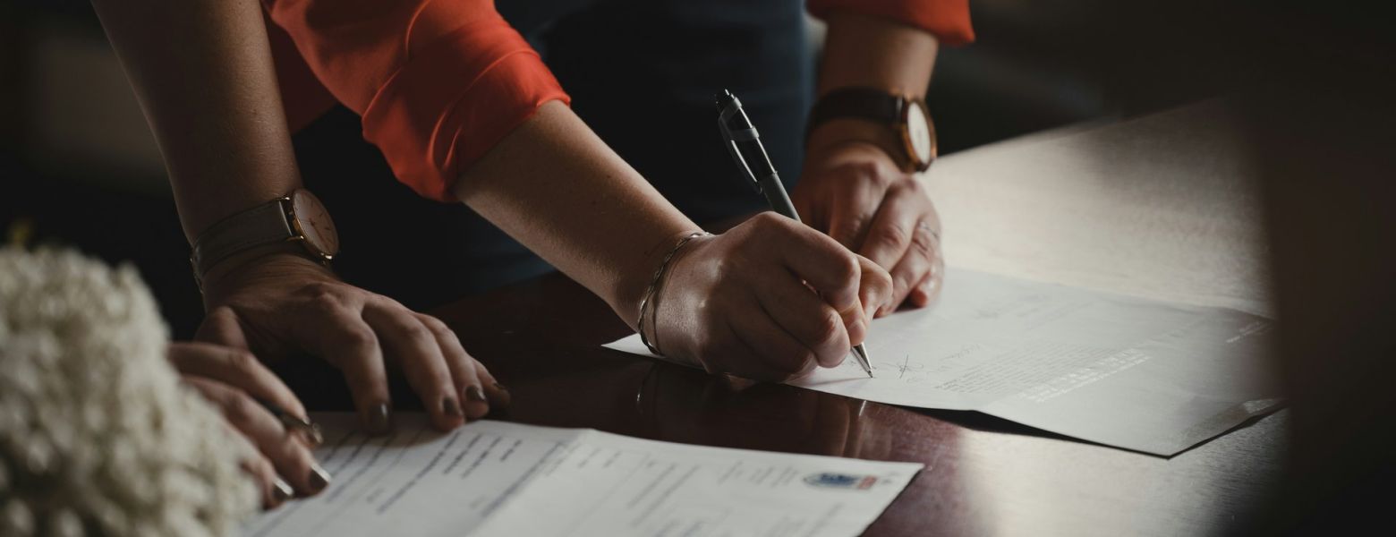 Person signing a contract