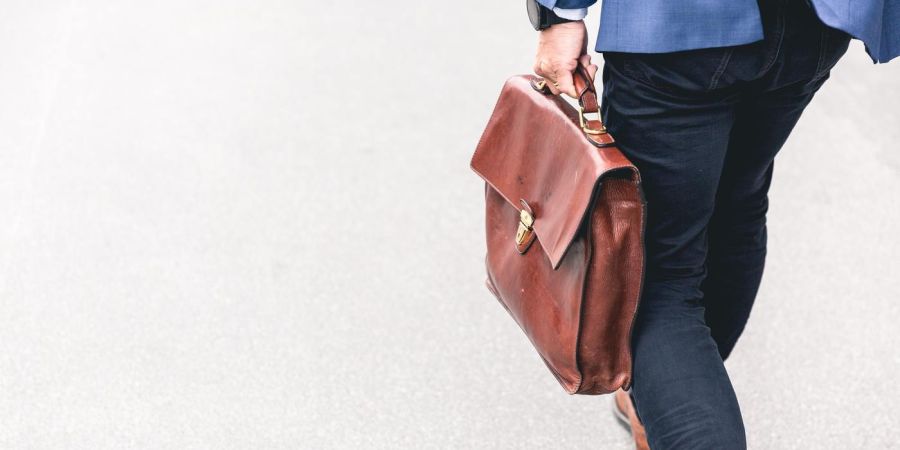 man with a leather briefcase
