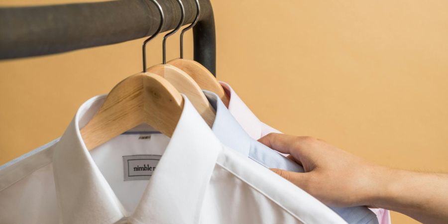 white collar shirt in a closet