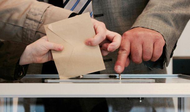 submitting ballot into box
