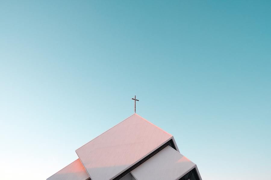 church steeple with a cross, blue sky, outdoors