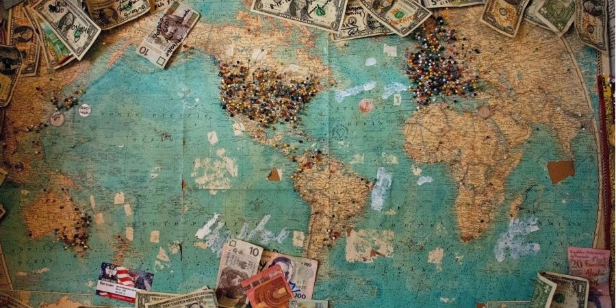 a world map with money