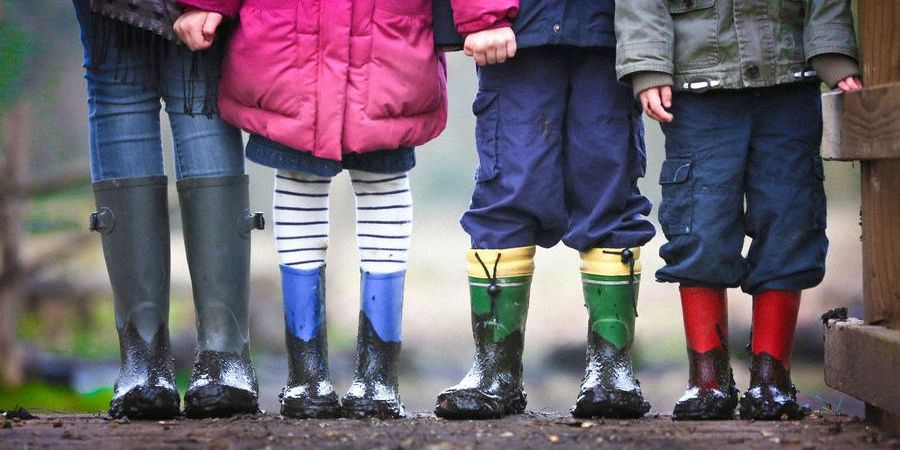 children lined up in boots