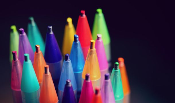 colored pencil tips, on black background