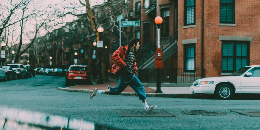 man running outside on street